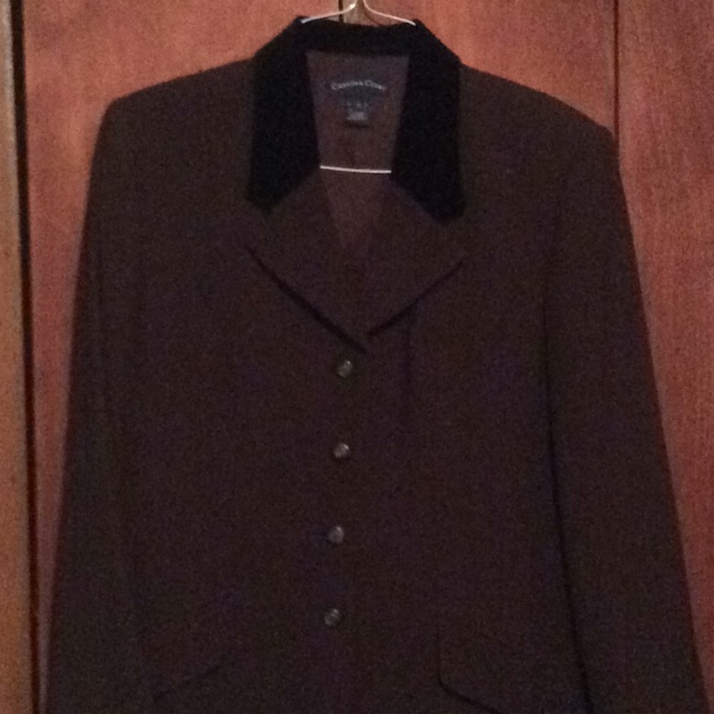 brown suit jacket with black trim around collar